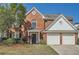 Charming brick home featuring a two-car garage and manicured landscaping at 3647 Bancroft Main Nw, Kennesaw, GA 30144