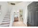 Bright foyer with hardwood floors, staircase, and modern decor at 3647 Bancroft Main Nw, Kennesaw, GA 30144