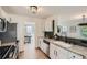 Modern kitchen featuring stainless appliances, granite countertops, and ample cabinet space at 3647 Bancroft Main Nw, Kennesaw, GA 30144