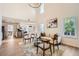 Open concept floorplan with living room flowing into kitchen and dining areas. Wood floors and neutral color scheme at 3647 Bancroft Main Nw, Kennesaw, GA 30144