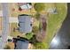 Aerial view of a well-maintained home with a private backyard, adjacent to a serene pond at 3950 Almandine Way, Cumming, GA 30040