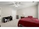 Bedroom with a ceiling fan, desk, and large window at 3950 Almandine Way, Cumming, GA 30040