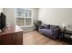 Bedroom with wood flooring, a window, and a couch at 3950 Almandine Way, Cumming, GA 30040