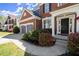 Charming brick home featuring a well-manicured lawn and inviting entryway with beautiful landscaping at 3950 Almandine Way, Cumming, GA 30040