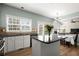 Spacious kitchen featuring a granite island and dining area with lots of natural light at 3950 Almandine Way, Cumming, GA 30040