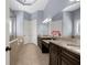 Bathroom featuring double sinks, granite countertops, and a soaking tub at 4620 Westgate Dr, Cumming, GA 30040