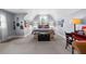 Charming bedroom featuring a cozy bed setup under an arched window, paired with a unique black chest and a vibrant red desk at 4620 Westgate Dr, Cumming, GA 30040