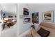 Bonus room featuring casual seating, music-themed wall decor, and glimpses into the larger entertainment area at 4620 Westgate Dr, Cumming, GA 30040