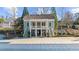 Charming clubhouse with a covered porch, well-maintained landscaping and ample parking at 4620 Westgate Dr, Cumming, GA 30040
