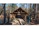 Charming covered bridge with pond and natural surroundings providing scenic views and tranquility at 4620 Westgate Dr, Cumming, GA 30040