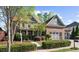 Beautiful brick home with a three car garage, mature landscaping, and manicured lawn at 4620 Westgate Dr, Cumming, GA 30040