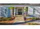 Charming building entrance featuring stone steps, black railings, and small palm trees for a welcoming ambiance at 4620 Westgate Dr, Cumming, GA 30040