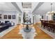 Spacious foyer with hardwood floors and elegant staircase leading to the upper level at 4620 Westgate Dr, Cumming, GA 30040
