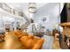 Open-concept living room with a fireplace, high ceilings, and hardwood floors at 4620 Westgate Dr, Cumming, GA 30040