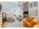 Bright living room with a fireplace and large windows at 4620 Westgate Dr, Cumming, GA 30040