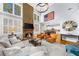 Spacious living room with a stone fireplace, large windows, and comfortable seating at 4620 Westgate Dr, Cumming, GA 30040