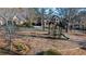 Community playground with mature trees and green space, perfect for outdoor activities at 4620 Westgate Dr, Cumming, GA 30040