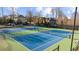 Overhead shot of Community tennis courts showcasing well-maintained facilities at 4620 Westgate Dr, Cumming, GA 30040