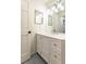 Updated bathroom with stylish vanity, ample lighting, and classic gray tile flooring at 1101 Collier Nw Rd # U2, Atlanta, GA 30318