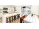 Bright dining area featuring granite countertops, bar seating, and natural light at 1101 Collier Nw Rd # U2, Atlanta, GA 30318