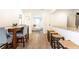 Open dining area with modern table and chairs, flowing into a living area, adjacent to the breakfast bar at 1101 Collier Nw Rd # U2, Atlanta, GA 30318