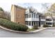 Exterior shot showcasing the building's unique architecture, private balconies, and lush landscaping at 1101 Collier Nw Rd # U2, Atlanta, GA 30318