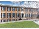 Brick exterior of a multi-story home featuring black shutters and a well-manicured lawn at 1101 Collier Nw Rd # U2, Atlanta, GA 30318