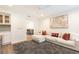 Bright living room boasts a large sectional sofa, modern art, and a ceiling fan at 1101 Collier Nw Rd # U2, Atlanta, GA 30318