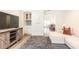 Open-concept living room, featuring a tv, sofa, and dining area beyond at 1101 Collier Nw Rd # U2, Atlanta, GA 30318