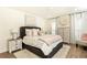 Serene main bedroom featuring a plush bed, neutral decor, and plenty of natural light at 1101 Collier Nw Rd # U2, Atlanta, GA 30318