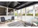 Inviting sunroom featuring tile floors, neutral color palette, and airy natural light at 1101 Collier Nw Rd # U2, Atlanta, GA 30318