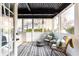 Bright sunroom with large windows, comfortable seating, and a stylish striped rug at 1101 Collier Nw Rd # U2, Atlanta, GA 30318