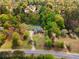 Aerial view of a home surrounded by lush greenery, showcasing its private setting and well-maintained grounds at 1350 Blackwell Rd, Marietta, GA 30066