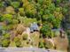 Aerial shot of a home highlighting its spacious lot, mature trees, long driveway, and proximity to the main road at 1350 Blackwell Rd, Marietta, GA 30066