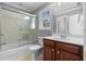 Bright bathroom with a glass-enclosed shower, a vanity with wood cabinets, and a toilet at 1350 Blackwell Rd, Marietta, GA 30066