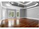 Large primary bedroom with tray ceilings, hardwood floors and large windows at 1350 Blackwell Rd, Marietta, GA 30066