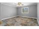 Bedroom featuring neutral walls, a ceiling fan, and unique slate flooring for a modern touch at 1350 Blackwell Rd, Marietta, GA 30066