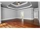 Spacious primary bedroom with hardwood flooring, tray ceilings, and neutral paint at 1350 Blackwell Rd, Marietta, GA 30066