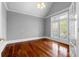 Bright bedroom with hardwood floors, a large window, and neutral wall color at 1350 Blackwell Rd, Marietta, GA 30066