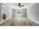Bedroom featuring neutral walls, a ceiling fan, and unique slate flooring for a modern touch at 1350 Blackwell Rd, Marietta, GA 30066
