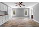 Bonus room with custom built-ins, tile flooring and a ceiling fan at 1350 Blackwell Rd, Marietta, GA 30066