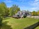 A two-story home with a screened porch, well-maintained lawn, and privacy fence at 1350 Blackwell Rd, Marietta, GA 30066