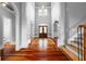 Spacious foyer with hardwood floors, a staircase, and views into adjacent rooms, creating a welcoming atmosphere at 1350 Blackwell Rd, Marietta, GA 30066