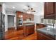 Gourmet kitchen with stainless steel appliances, granite counters, wood floors, and custom cabinets at 1350 Blackwell Rd, Marietta, GA 30066