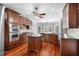 Kitchen featuring custom cabinets, granite countertops, a center island, stainless appliances, and hardwood floors at 1350 Blackwell Rd, Marietta, GA 30066