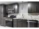 Close-up of the modern kitchen featuring stainless steel appliances and granite countertops at 1350 Blackwell Rd, Marietta, GA 30066