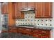 Kitchen features wooden cabinetry, granite countertops and stainless steel appliances at 1350 Blackwell Rd, Marietta, GA 30066