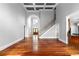 Inviting living room with hardwood floors, staircase and arched doorway offering seamless flow to other spaces at 1350 Blackwell Rd, Marietta, GA 30066