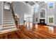 Spacious living room with hardwood floors, fireplace, and staircase at 1350 Blackwell Rd, Marietta, GA 30066