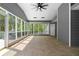 Large screened porch with a ceiling fan, offering outdoor living at 1350 Blackwell Rd, Marietta, GA 30066